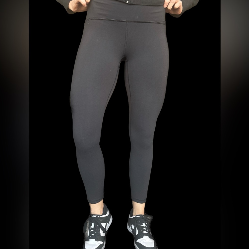 Lululemon black leggings size 6 with sheer cut out on lateral leg